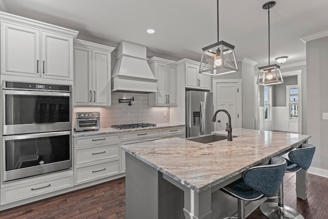 512 River Watch Way, Winchester, TN 37398 - kitchen with stainless steel appliances, premium range hood, crown molding, dark wood-style floors, and a sink
