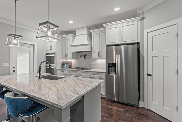 512 River Watch Way, Winchester, TN 37398 - kitchen featuring appliances with stainless steel finishes, custom range hood, a sink, ornamental molding, and tasteful backsplash