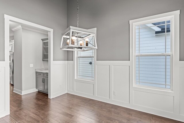 512 River Watch Way, Winchester, TN 37398 - unfurnished dining area featuring a decorative wall, wainscoting, a chandelier, dark wood finished floors, and healthy amount of natural light