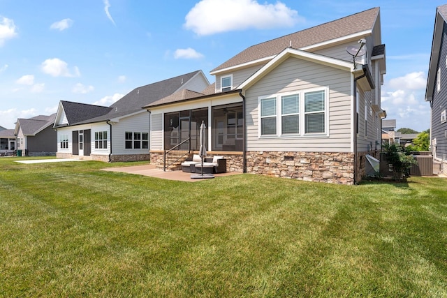512 River Watch Way, Winchester, TN 37398 - rear view of property with a sunroom, stone siding, a patio area, and a lawn
