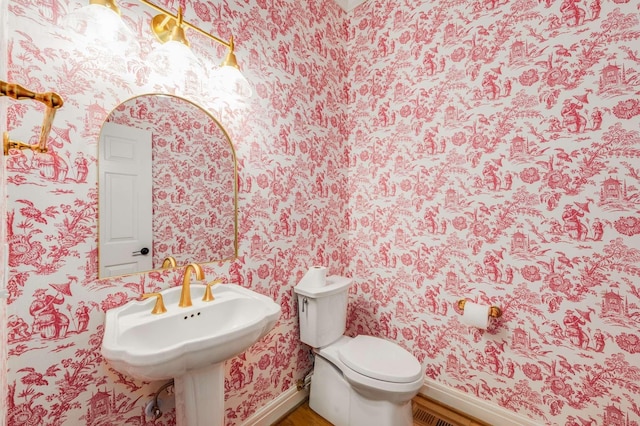 316 Whitworth Way, Nashville, TN 37205 - half bathroom featuring wallpapered walls, baseboards, wood finished floors, toilet, and a sink