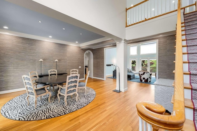 316 Whitworth Way, Nashville, TN 37205 - dining room with arched walkways, wood finished floors, baseboards, decorative columns, and crown molding