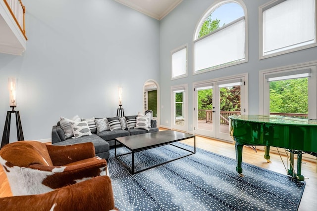 316 Whitworth Way, Nashville, TN 37205 - living room featuring a towering ceiling, wood finished floors, french doors, ornamental molding, and healthy amount of natural light