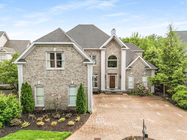 316 Whitworth Way, Nashville, TN 37205 - view of front facade featuring a chimney, brick siding, and roof with shingles