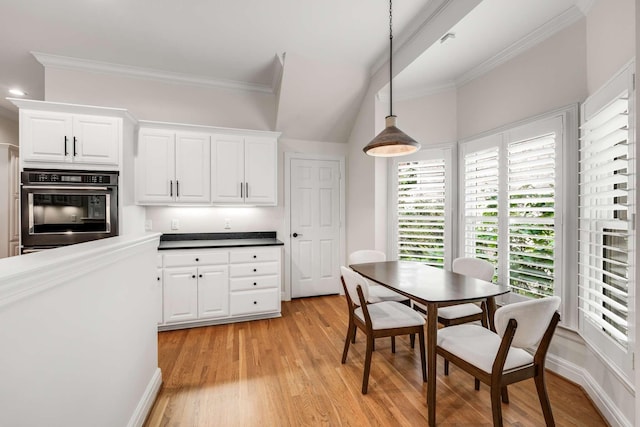 316 Whitworth Way, Nashville, TN 37205 - kitchen with oven, crown molding, white cabinets, pendant lighting, and light wood-style flooring