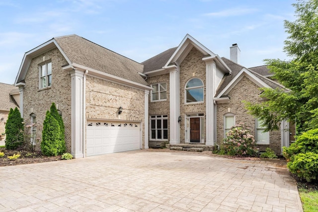 316 Whitworth Way, Nashville, TN 37205 - view of front of property featuring brick siding, a chimney, a shingled roof, decorative driveway, and an attached garage
