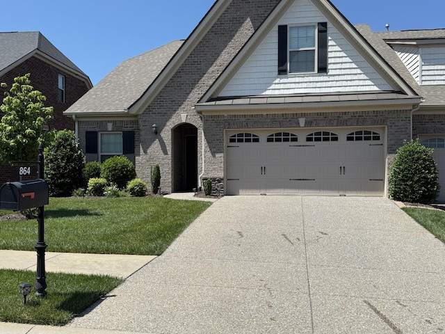 864 Meadowcrest Way Unit 823, Lebanon, TN 37090 - view of front facade with concrete driveway, a front lawn, brick siding, a shingled roof, and a garage
