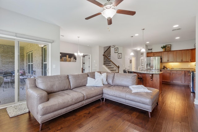 864 Meadowcrest Way Unit 823, Lebanon, TN 37090 - living room with dark wood finished floors, stairs, ceiling fan, recessed lighting, and a chandelier