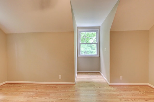 339 Thompson Ln, Clarksville, TN 37040 - additional living space with vaulted ceiling, light wood finished floors, and baseboards