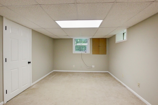 339 Thompson Ln, Clarksville, TN 37040 - below grade area with light colored carpet, a drop ceiling, and baseboards