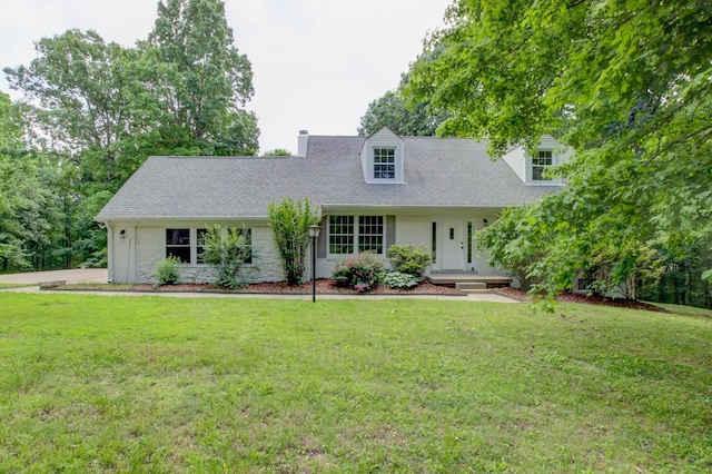 339 Thompson Ln, Clarksville, TN 37040 - cape cod house featuring a front lawn, a chimney, roof with shingles, and stone siding