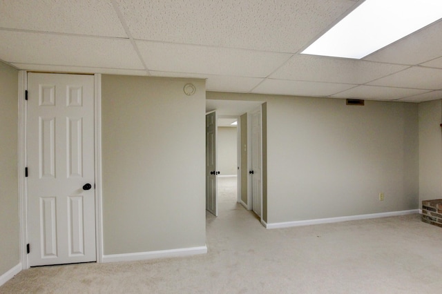 339 Thompson Ln, Clarksville, TN 37040 - finished below grade area featuring a paneled ceiling, carpet flooring, and baseboards