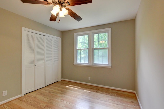 339 Thompson Ln, Clarksville, TN 37040 - unfurnished bedroom with light wood-style floors, baseboards, a closet, and ceiling fan