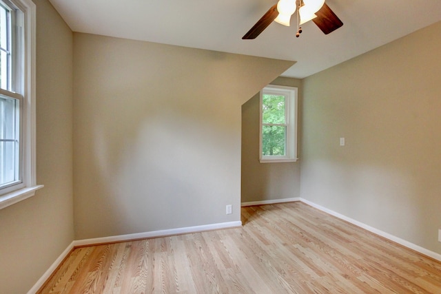 339 Thompson Ln, Clarksville, TN 37040 - empty room with light wood-style flooring, a ceiling fan, baseboards, and lofted ceiling
