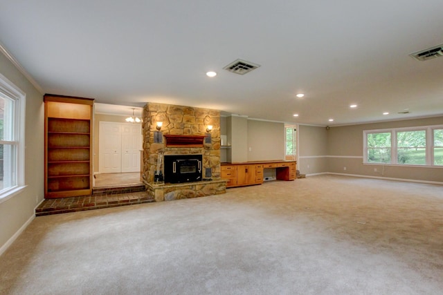 339 Thompson Ln, Clarksville, TN 37040 - unfurnished living room featuring ornamental molding, baseboards, a stone fireplace, recessed lighting, and carpet