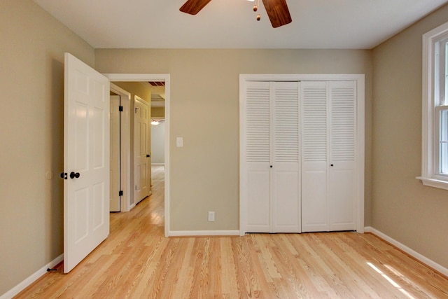 339 Thompson Ln, Clarksville, TN 37040 - unfurnished bedroom with light wood-style floors, baseboards, a closet, and ceiling fan