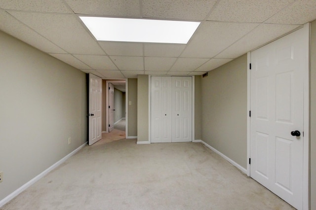 339 Thompson Ln, Clarksville, TN 37040 - unfurnished bedroom featuring a drop ceiling, light colored carpet, baseboards, and a closet