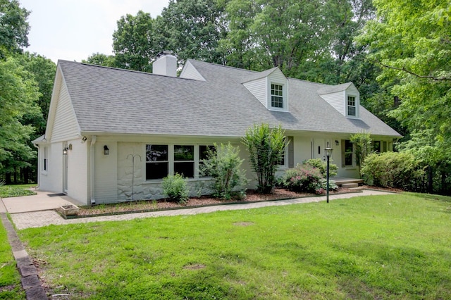339 Thompson Ln, Clarksville, TN 37040 - cape cod home with a shingled roof, a chimney, a front yard, and a porch
