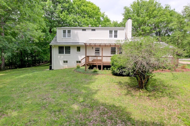 339 Thompson Ln, Clarksville, TN 37040 - rear view of house with a yard, a chimney, a deck, view of scattered trees, and metal roof