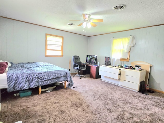 118 Bone Cave Rd, Rock Island, TN 38581 - carpeted bedroom with a desk, crown molding, a ceiling fan, and wood walls