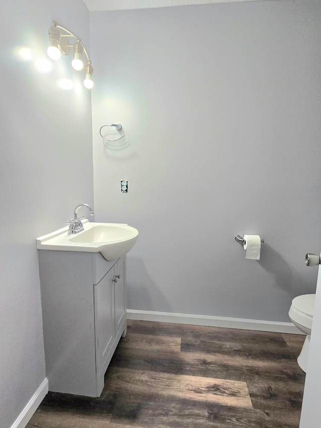 118 Bone Cave Rd, Rock Island, TN 38581 - bathroom featuring vanity, wood finished floors, toilet, and baseboards