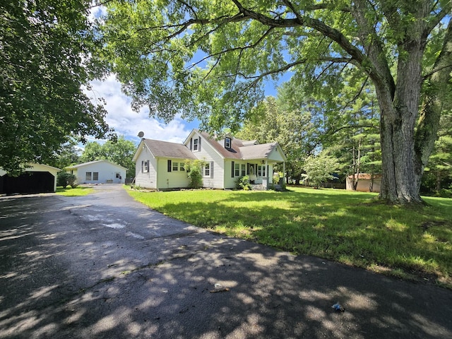 118 Bone Cave Rd, Rock Island, TN 38581 - view of front of home with driveway, a front yard, and an outdoor structure