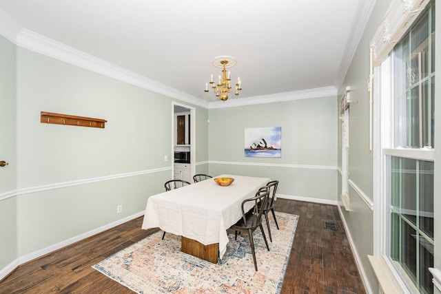 909 Miranda Pl, Franklin, TN 37067 - dining room with a chandelier, crown molding, wood finished floors, and baseboards