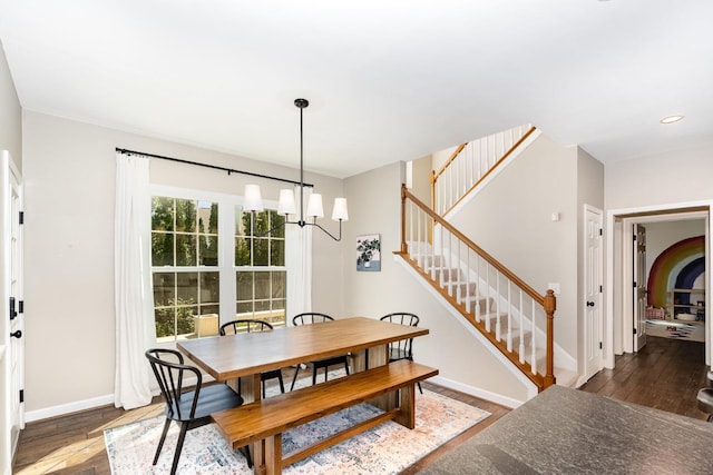 909 Miranda Pl, Franklin, TN 37067 - dining space with a chandelier, wood finished floors, baseboards, stairway, and recessed lighting