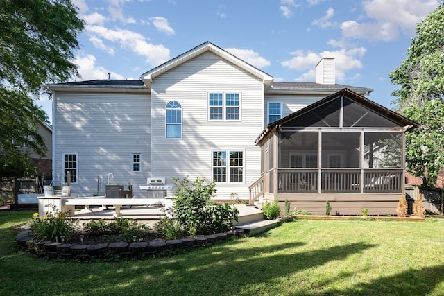909 Miranda Pl, Franklin, TN 37067 - rear view of house with a sunroom, a lawn, and a chimney