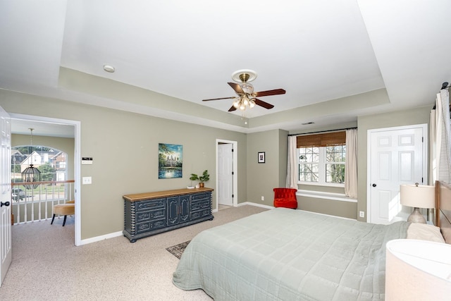 909 Miranda Pl, Franklin, TN 37067 - bedroom with a tray ceiling, baseboards, carpet, and a ceiling fan