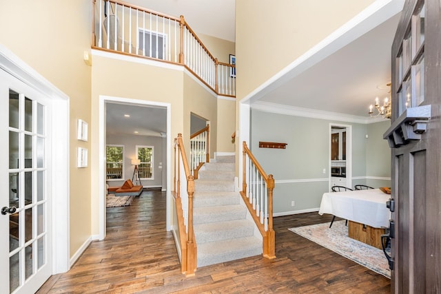 909 Miranda Pl, Franklin, TN 37067 - staircase with wood finished floors, baseboards, crown molding, and a chandelier
