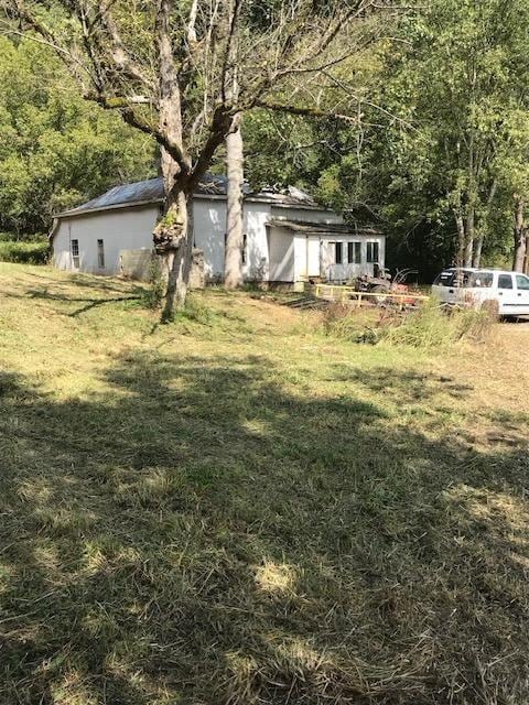 6908 Jennings Creek Rd, Red Boiling Springs, TN 37150 - view of green lawn with a forest view