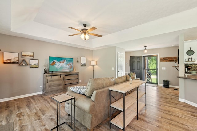 2277 Belotes Ferry Rd, Lebanon, TN 37087 - living room with a ceiling fan, light wood-type flooring, baseboards, and a tray ceiling