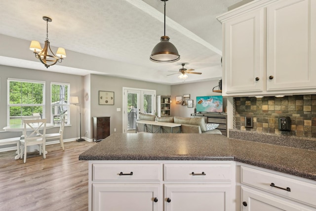 2277 Belotes Ferry Rd, Lebanon, TN 37087 - kitchen with ceiling fan, a peninsula, open floor plan, healthy amount of natural light, and a textured ceiling