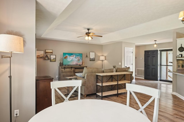 2277 Belotes Ferry Rd, Lebanon, TN 37087 - dining room with ceiling fan, wood finished floors, baseboards, and a tray ceiling