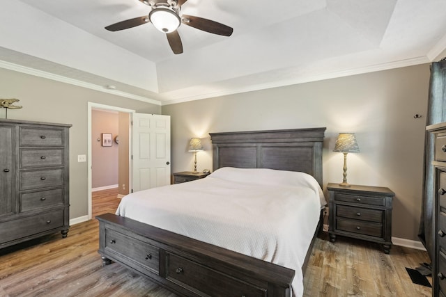 2277 Belotes Ferry Rd, Lebanon, TN 37087 - bedroom with a tray ceiling, wood finished floors, baseboards, crown molding, and a ceiling fan