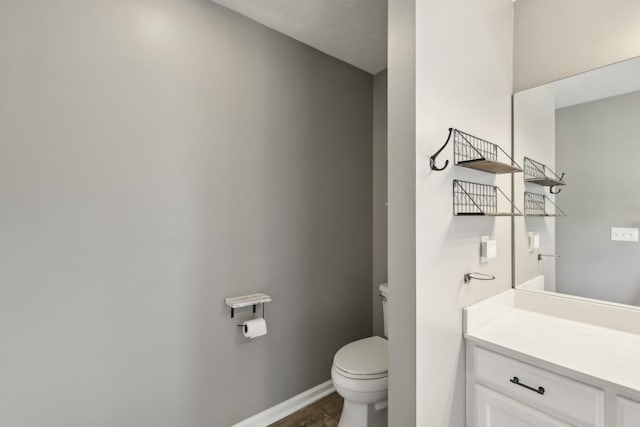 2277 Belotes Ferry Rd, Lebanon, TN 37087 - bathroom with toilet, vanity, and baseboards