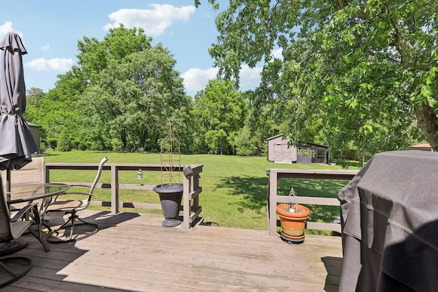 2277 Belotes Ferry Rd, Lebanon, TN 37087 - deck featuring grilling area, a storage shed, a yard, and an outbuilding