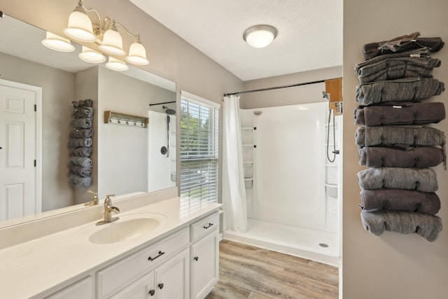 2277 Belotes Ferry Rd, Lebanon, TN 37087 - bathroom featuring a stall shower, wood finished floors, and vanity