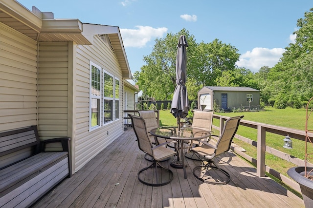 2277 Belotes Ferry Rd, Lebanon, TN 37087 - wooden terrace featuring outdoor dining area, a lawn, and an outbuilding