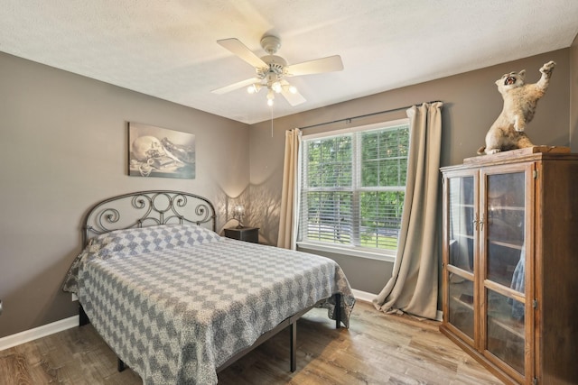 2277 Belotes Ferry Rd, Lebanon, TN 37087 - bedroom featuring baseboards, wood finished floors, and a ceiling fan