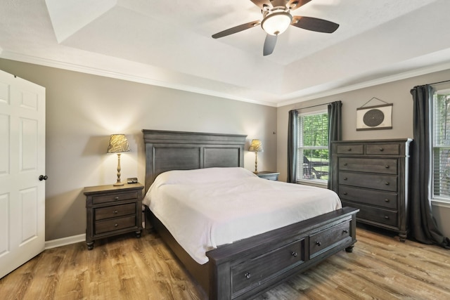 2277 Belotes Ferry Rd, Lebanon, TN 37087 - bedroom with a tray ceiling, light wood-type flooring, crown molding, and ceiling fan