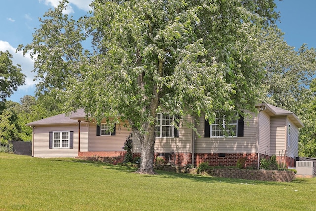 2277 Belotes Ferry Rd, Lebanon, TN 37087 - view of front of house with a front yard, crawl space, and central AC unit