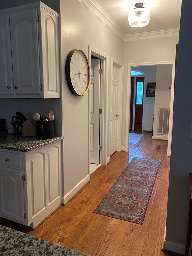 415 Ashley Ln, Kingston Springs, TN 37082 - hallway with ornamental molding, light wood-style floors, and baseboards