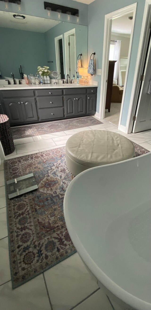 415 Ashley Ln, Kingston Springs, TN 37082 - full bath featuring double vanity, a freestanding bath, and tile patterned flooring