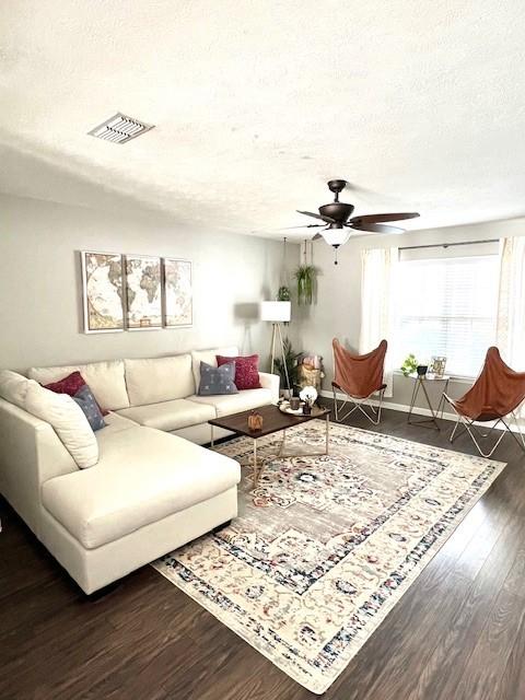 1011 Wolves Den Pl, Murfreesboro, TN 37128 - living room featuring a ceiling fan, wood finished floors, and a textured ceiling