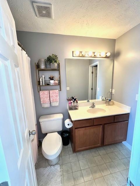 1011 Wolves Den Pl, Murfreesboro, TN 37128 - full bath featuring a textured ceiling, vanity, toilet, and tile patterned flooring