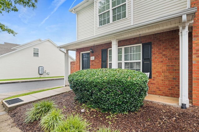 1011 Wolves Den Pl, Murfreesboro, TN 37128 - view of exterior entry with covered porch and brick siding