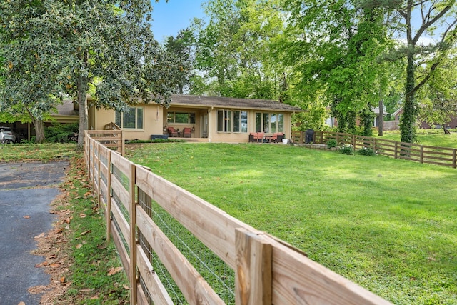 209 Woods Dr, Columbia, TN 38401 - view of front of property with stucco siding, driveway, and a patio area