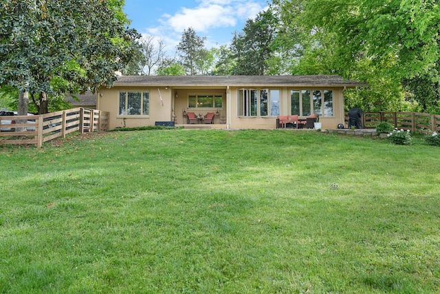 209 Woods Dr, Columbia, TN 38401 - rear view of house with stucco siding and a patio